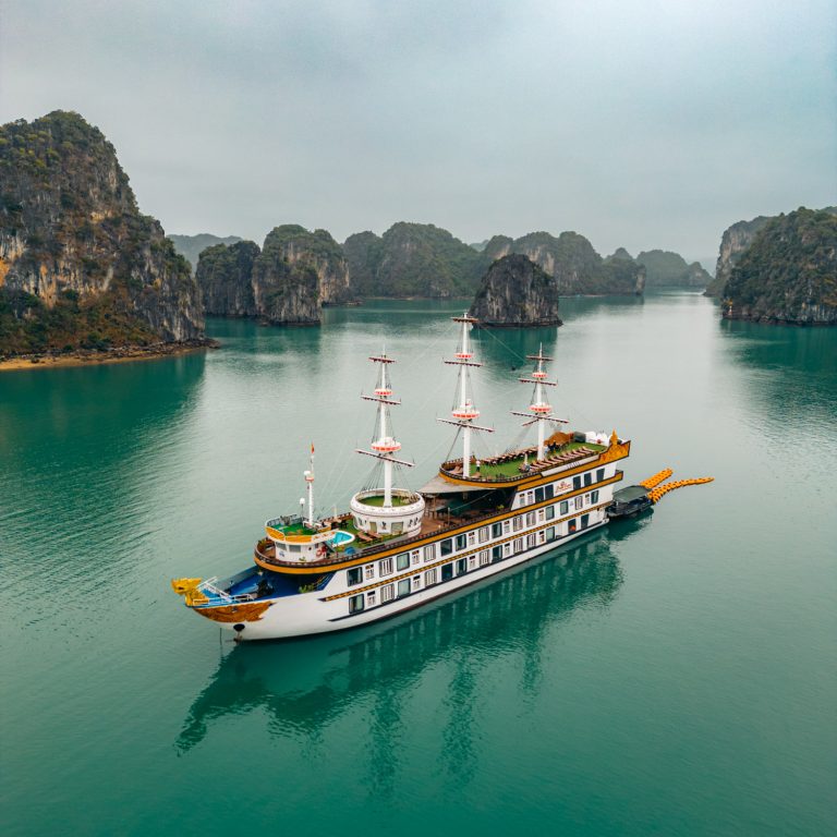 Indochina Junk Dragon Legend aerial view of ship in Bai Tu Long Bay